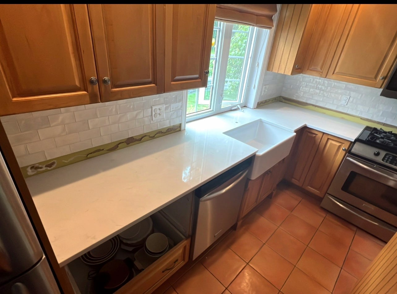 Custom quartz kitchen island, hand-fabricated in Quispamsis